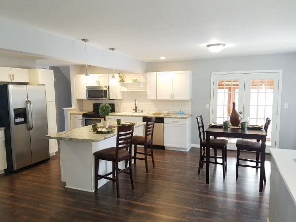 interior view of a kitchen with white cabinets